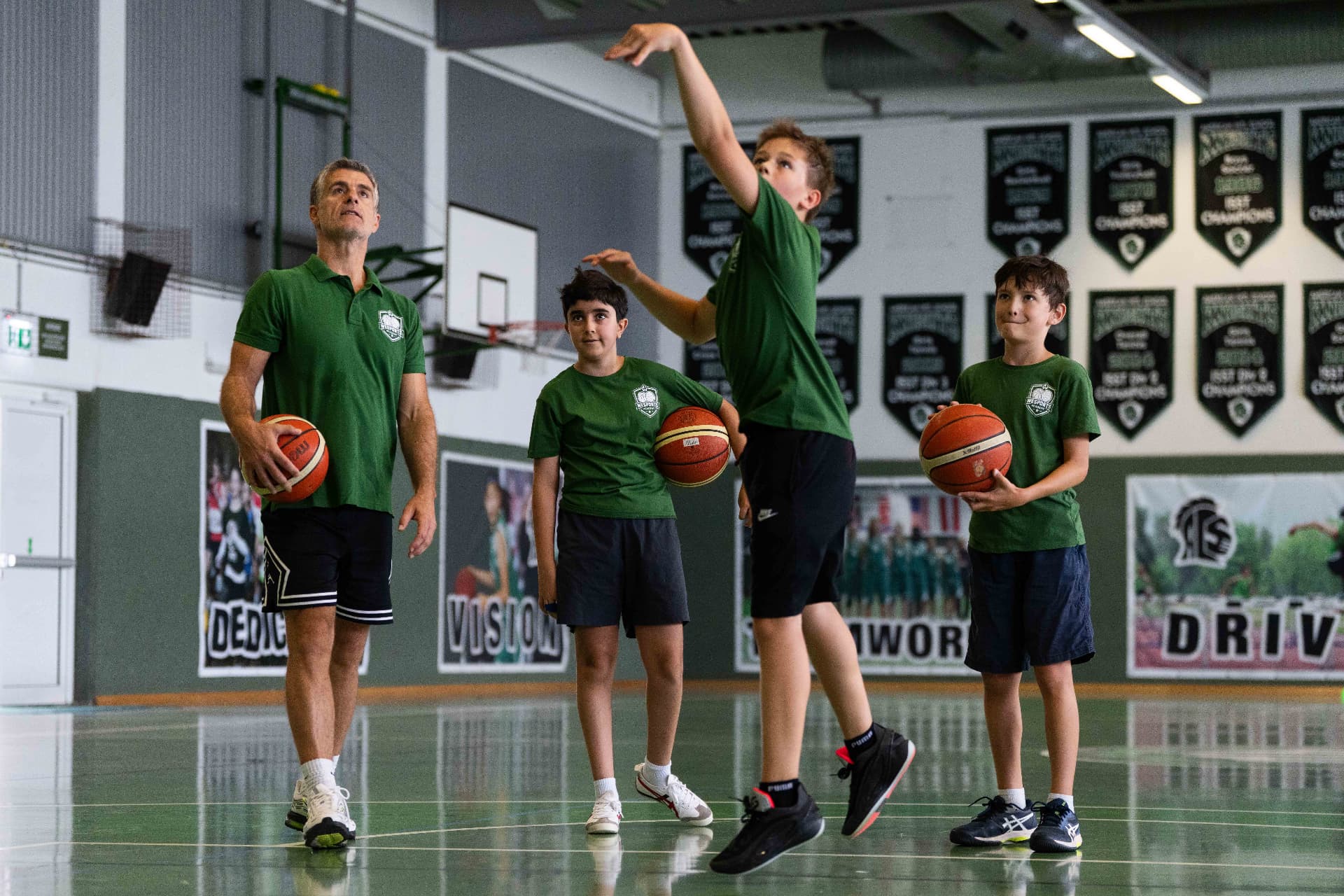 Young player practicing basketball shooting technique